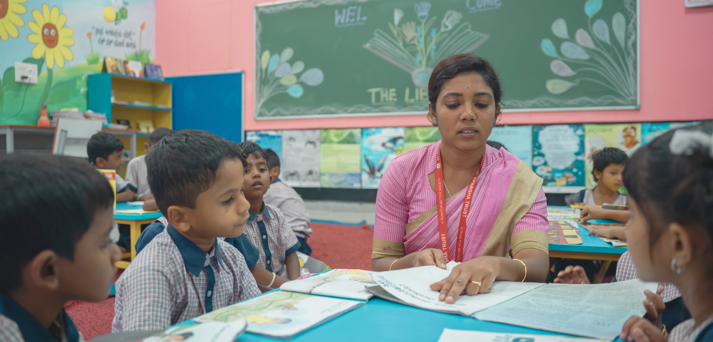 Literacy interventions at scale, an educator guiding children through a literacy lesson with Room to Read in India